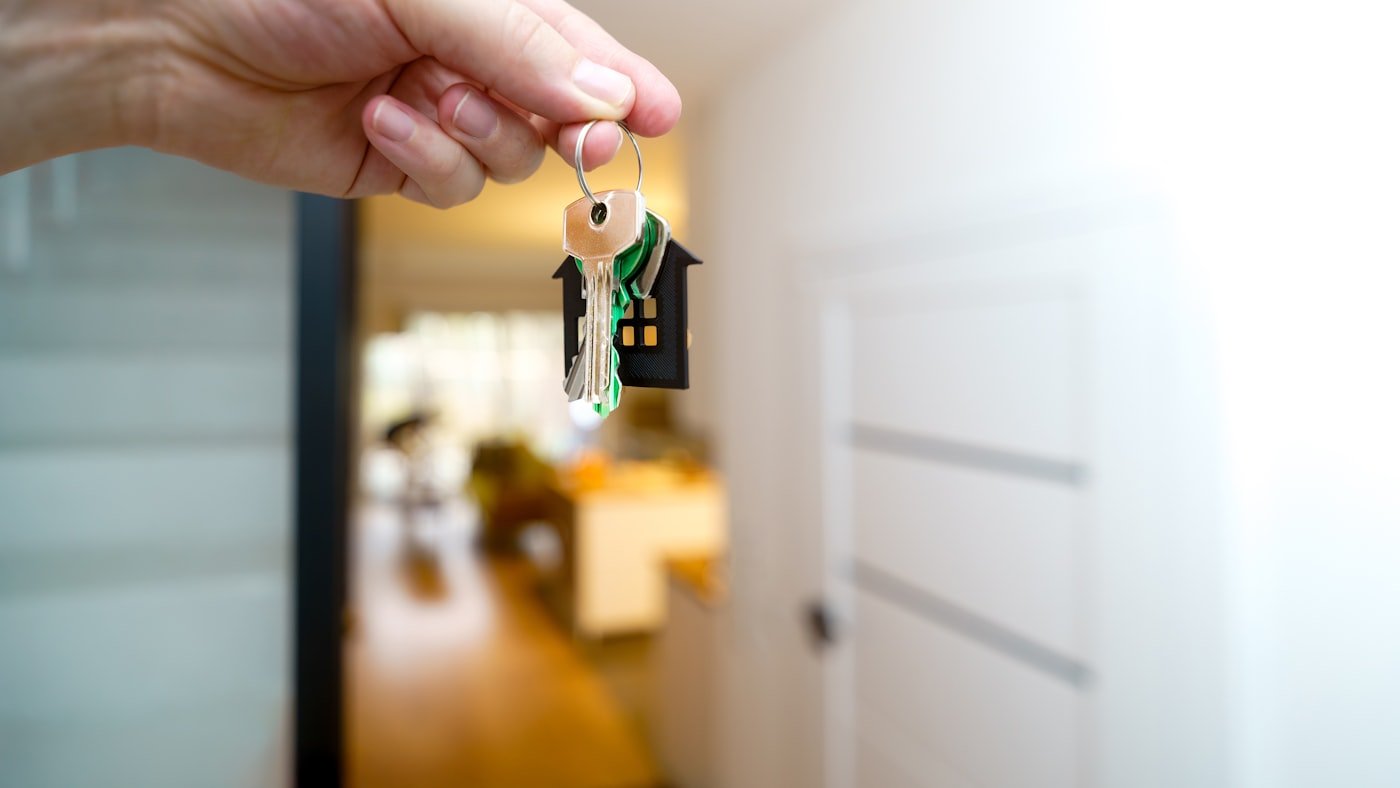 An agent handing over the keys to a property